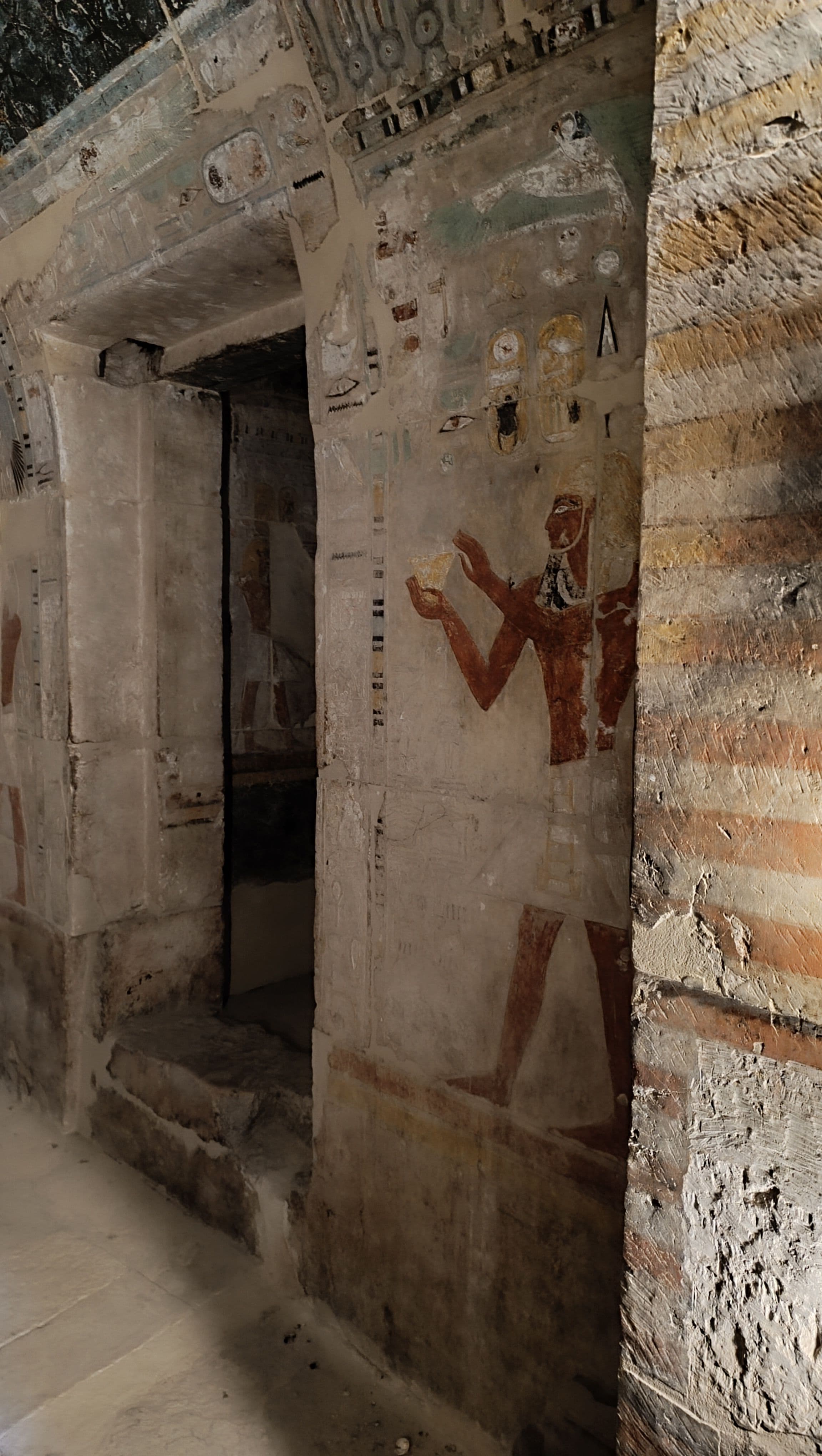Painted tomb walls, colour still vivid.
