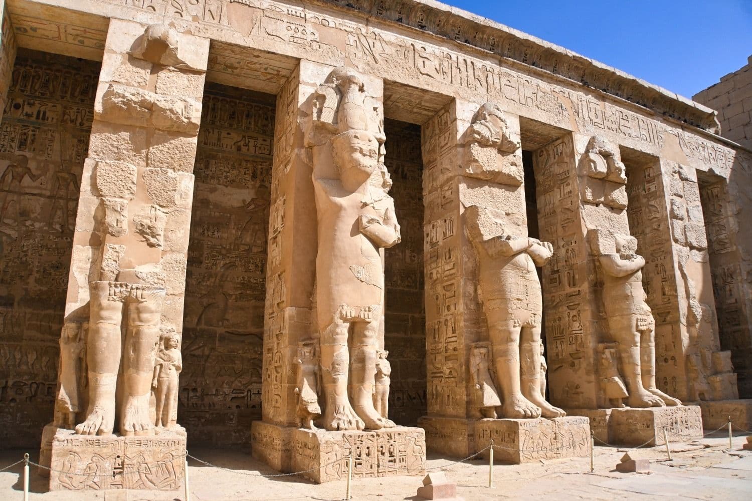 The memorial temple against the cliffs.
