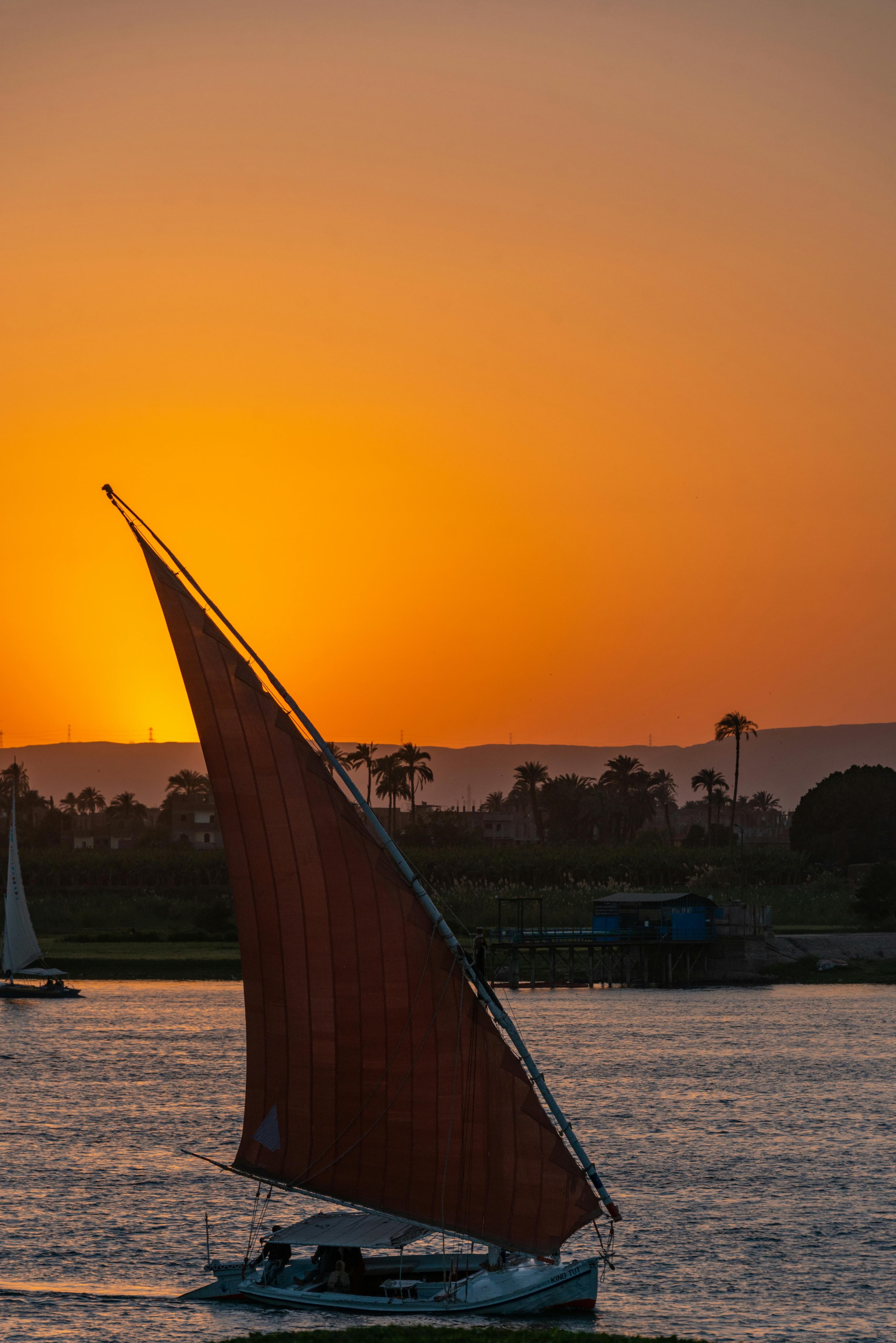 The sail up the river, the hills behind.
