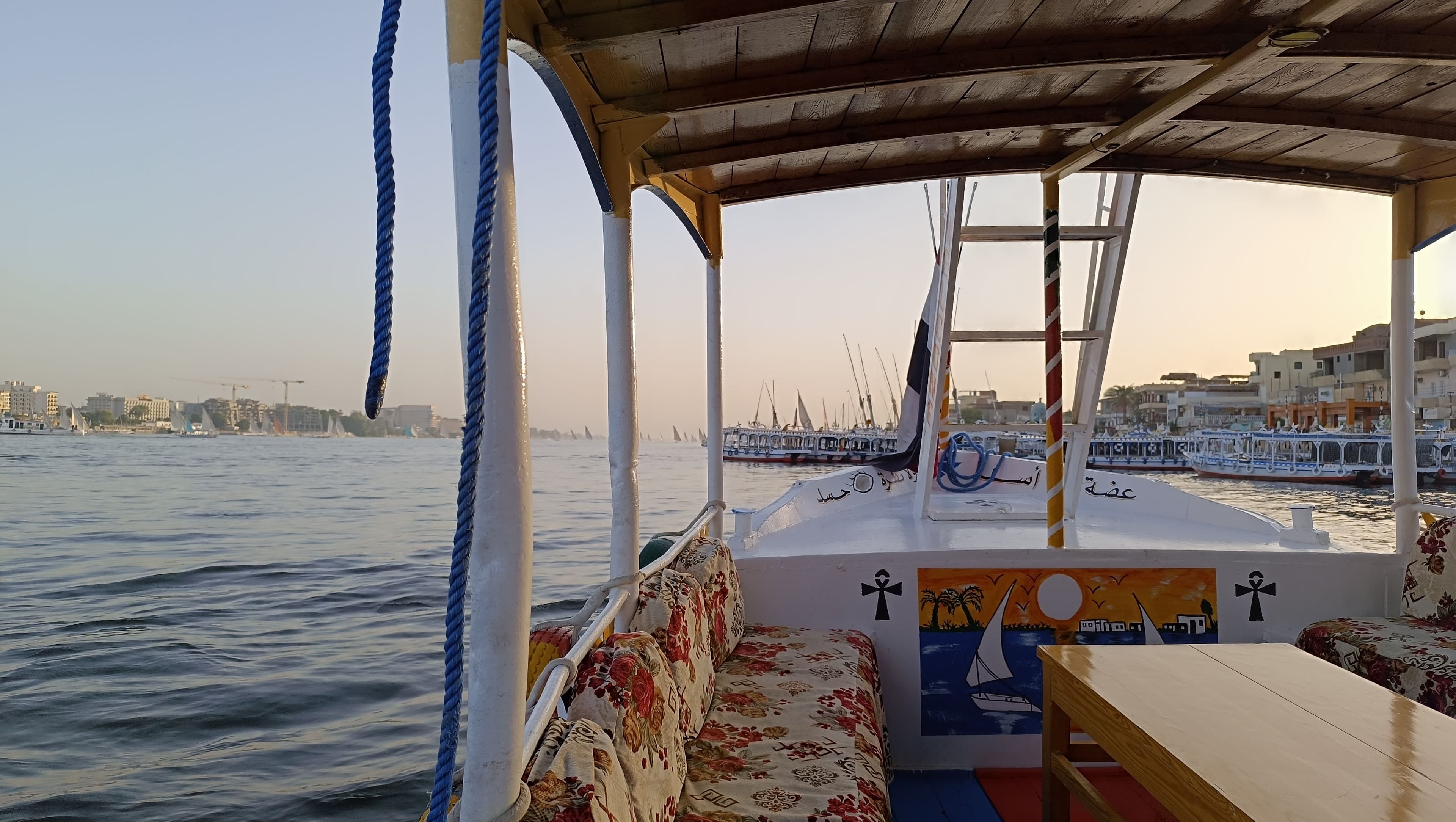 The deck at golden hour, the harbour behind.